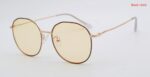 Black and gold geometric sunglasses with yellow lenses