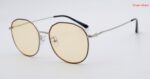 Silver and black polygon sunglasses with yellow lenses