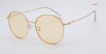 gold geometric sunglasses with yellow lenses