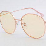 Rose gold geometric sunglasses with yellow lenses
