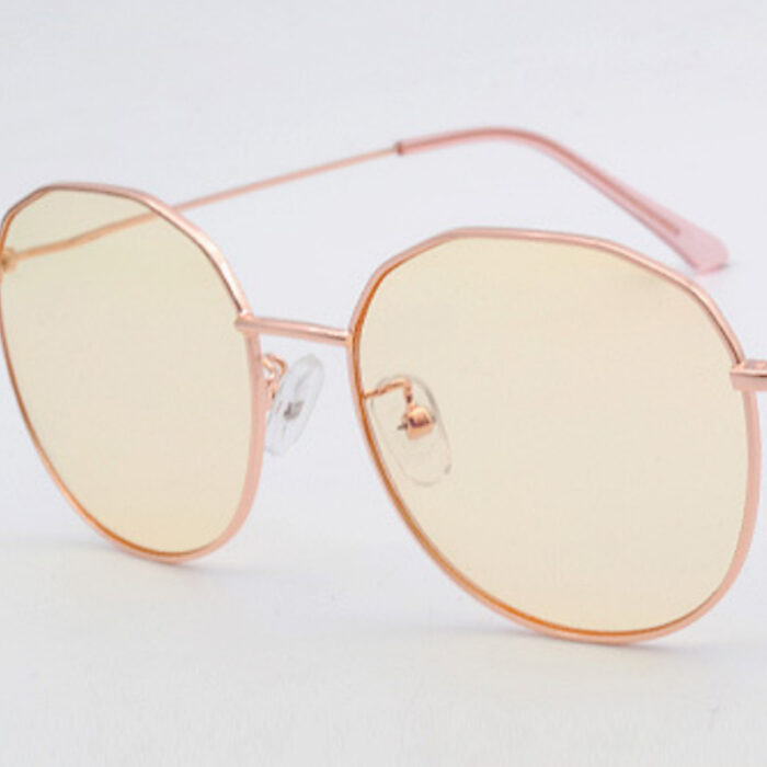 Rose gold geometric sunglasses with yellow lenses