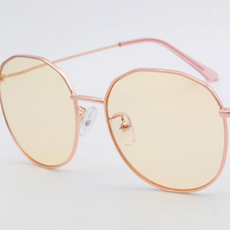 Rose gold geometric sunglasses with yellow lenses